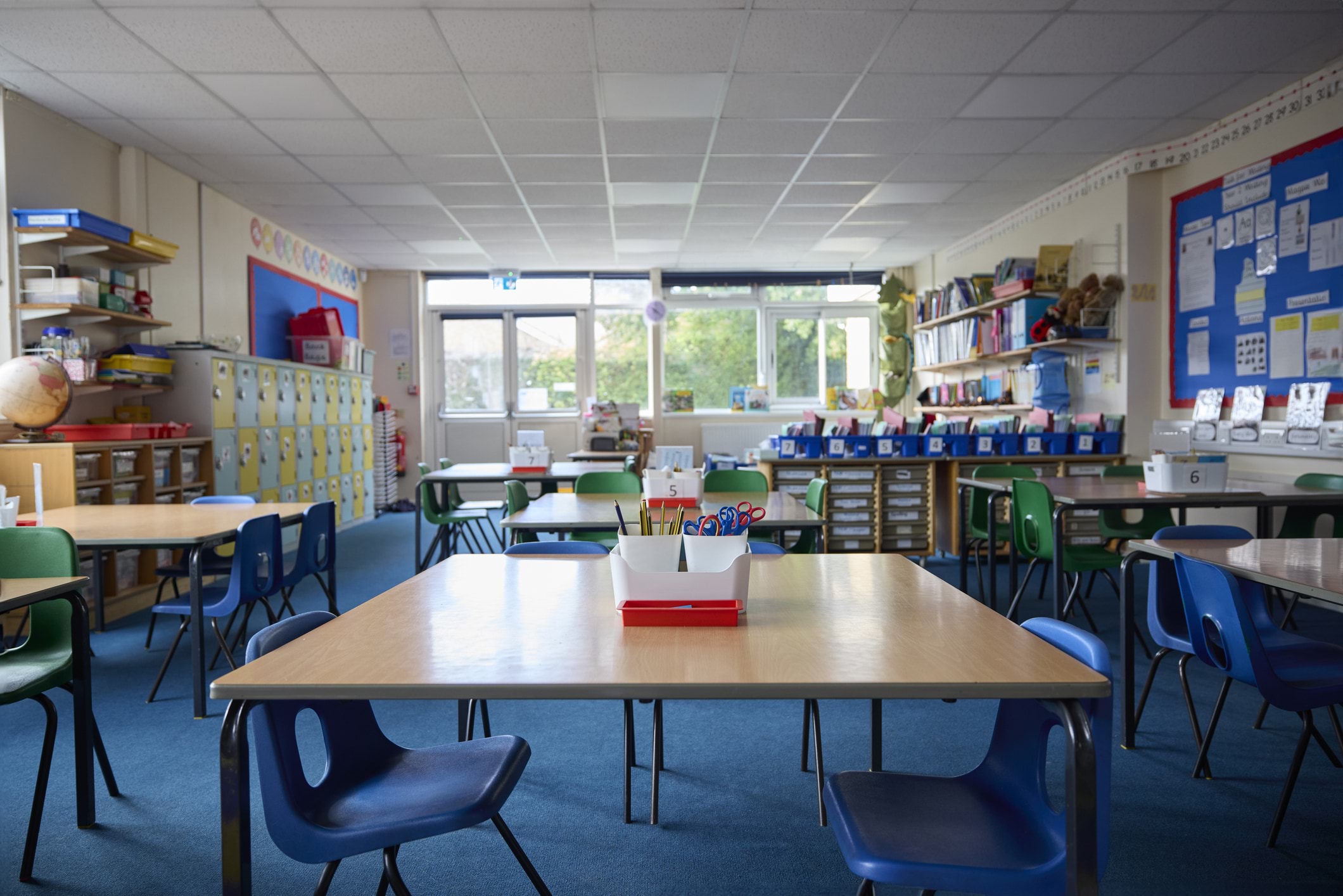 Early childhood children's room in education setting showing desks and tables